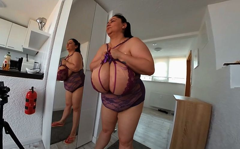 Alice in the Mirror; BBW brunette with huge tits stripping Slideshow